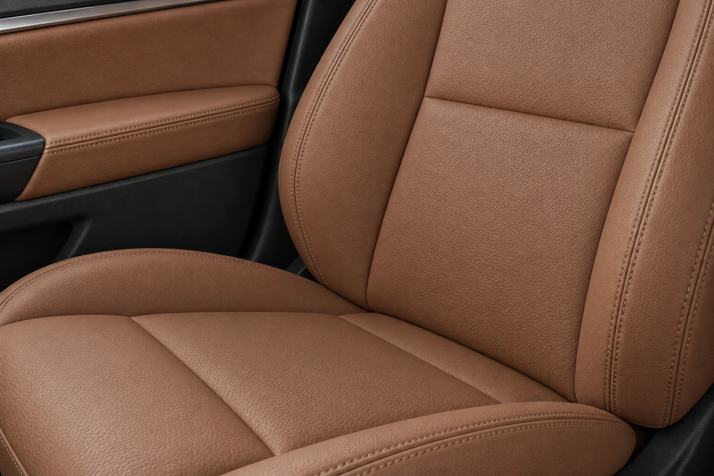 Upholstery concept showing a tan car seat and coordinating door trim